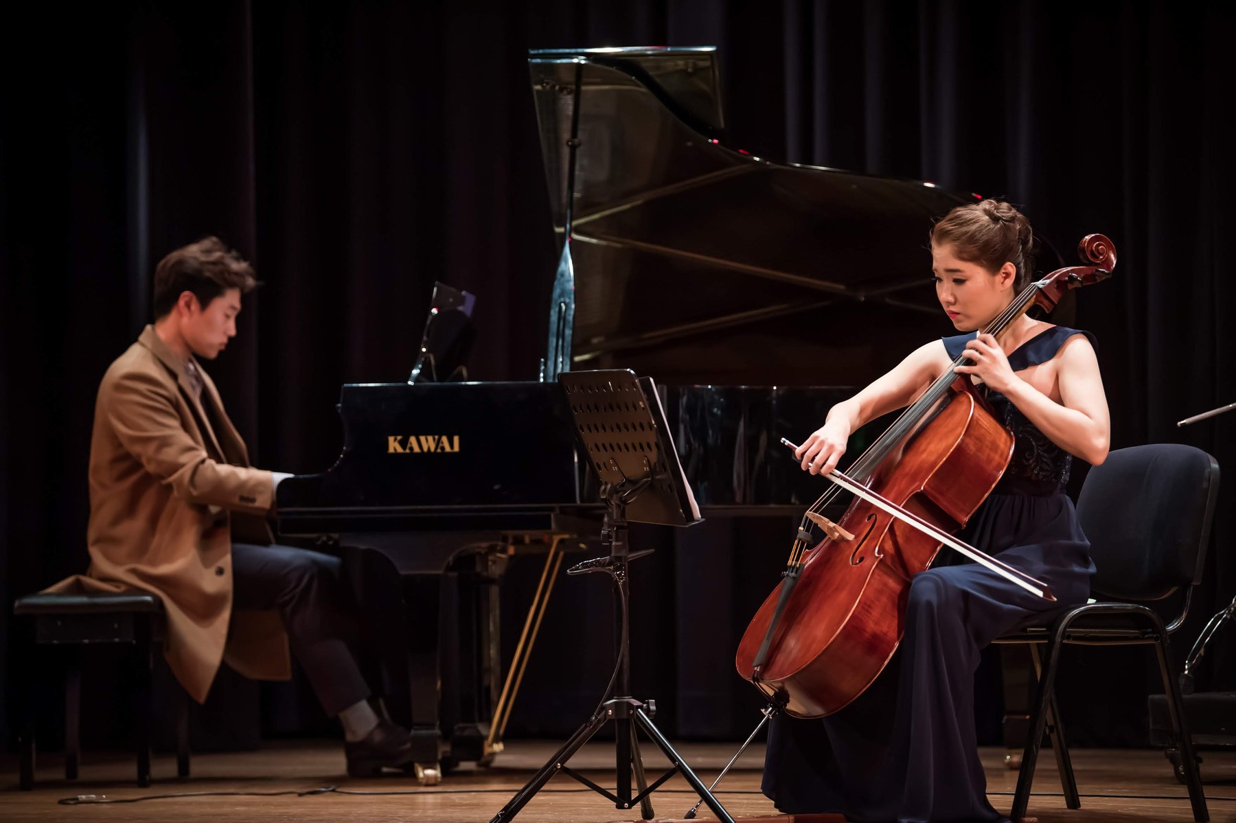 Musicians performing together — piano and cello